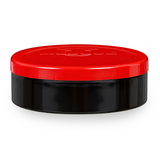 A round cosmetic jar with a glossy black body and a vibrant red screw-top lid, shown on a clean white background.
