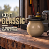 Desert-tan Mud Jug Classic with black funnel on a workshop bench. Keep it classic—the original Mud Jug, ready for anywhere.